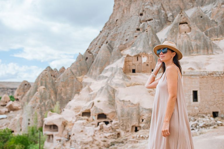 young-woman-on-the-edge-of-canyon-in-cappodocia-TYYWZ6D